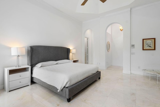 bedroom featuring ceiling fan, baseboards, arched walkways, and ornamental molding