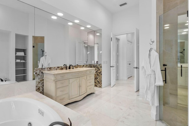 bathroom with built in shelves, recessed lighting, visible vents, and a stall shower