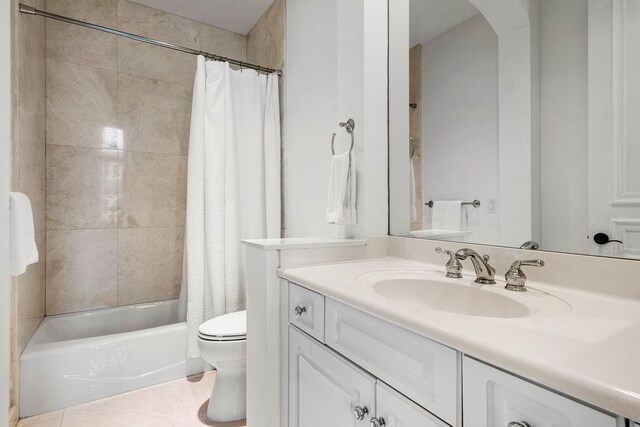 full bathroom with tile patterned flooring, toilet, vanity, and shower / tub combo with curtain