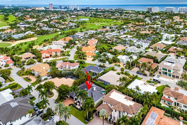 bird's eye view featuring view of golf course, a water view, a residential view, and a view of city