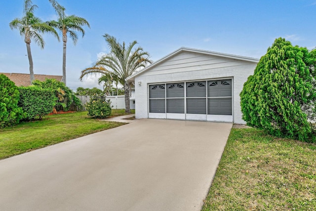 detached garage featuring fence