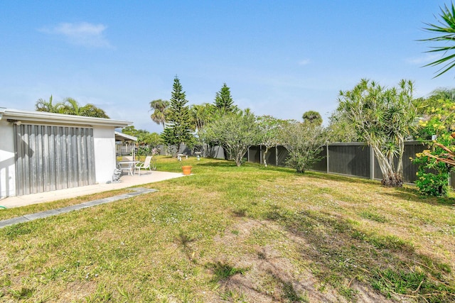 view of yard featuring a patio and a fenced backyard