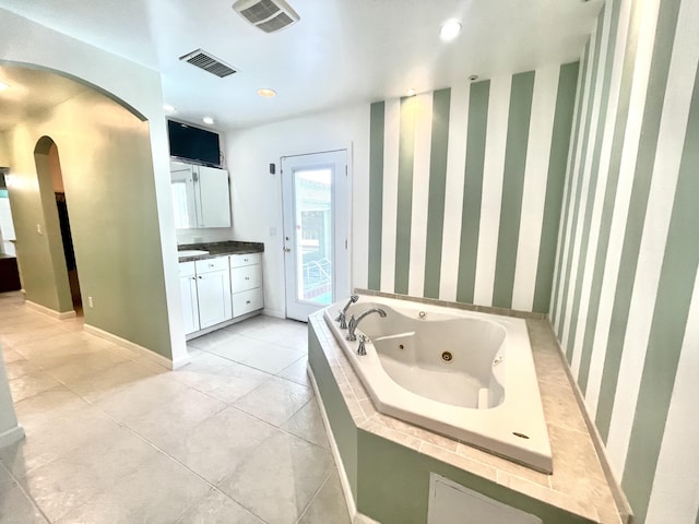 full bathroom with vanity, visible vents, wallpapered walls, and a jetted tub