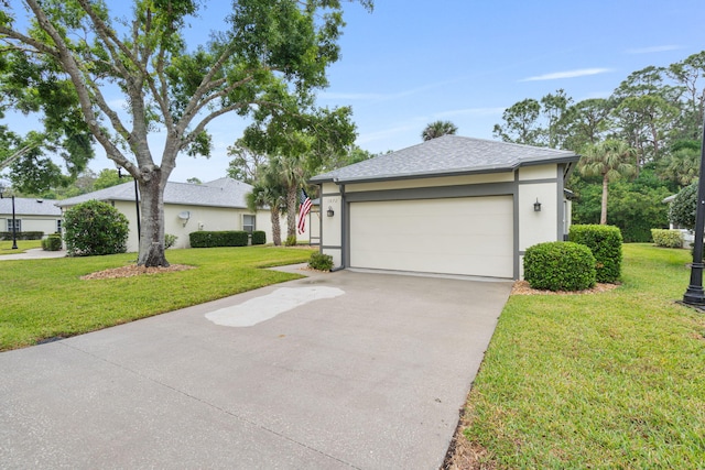 ranch-style home with a garage, driveway, stucco siding, and a front lawn