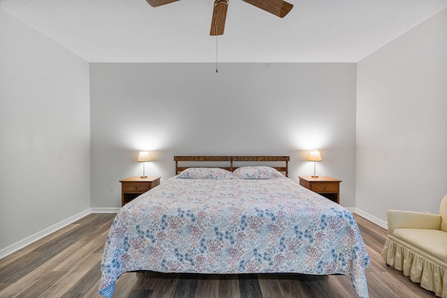 bedroom featuring ceiling fan, baseboards, and wood finished floors