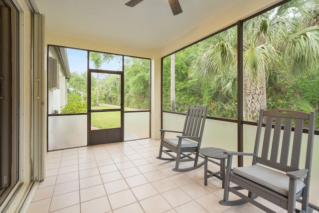 sunroom / solarium with a ceiling fan