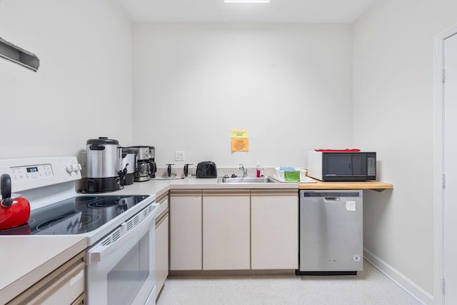 kitchen featuring a sink, light countertops, white range with electric cooktop, black microwave, and stainless steel dishwasher