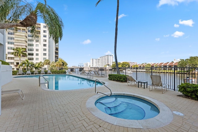 2880 NE 14th Street Cswy Unit 113, Pompano Beach, FL 33062 - pool with a patio area, a water view, and fence