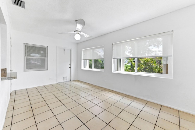7000 NW 95th Ter, Tamarac, FL 33321 - spare room featuring visible vents, a ceiling fan, and light tile patterned flooring