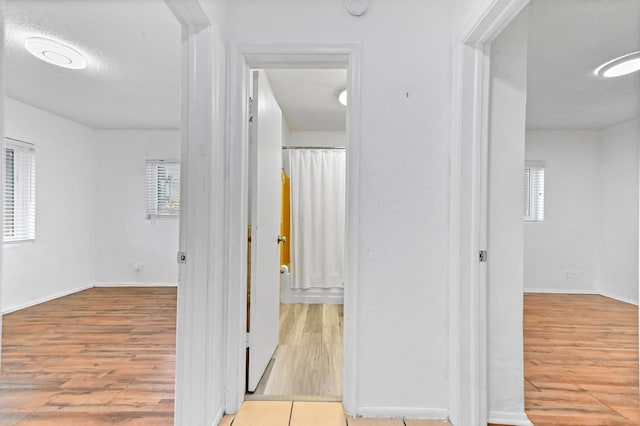 7000 NW 95th Ter, Tamarac, FL 33321 - hall featuring baseboards and wood finished floors