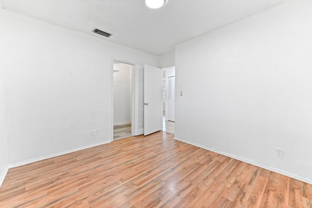 7000 NW 95th Ter, Tamarac, FL 33321 - empty room with baseboards, visible vents, and light wood-type flooring