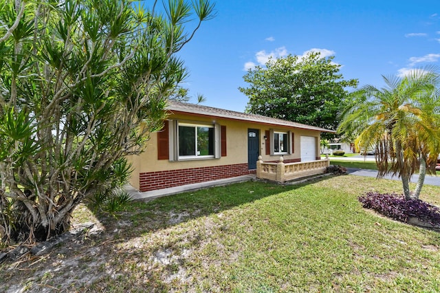 7000 NW 95th Ter, Tamarac, FL 33321 - ranch-style house featuring stucco siding, a front yard, and brick siding