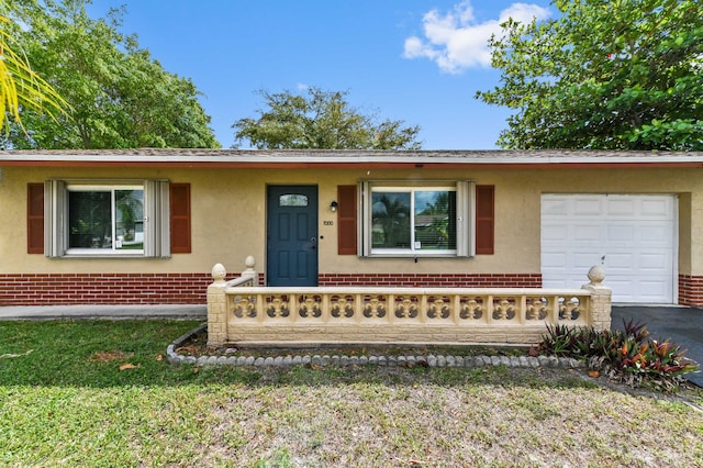 7000 NW 95th Ter, Tamarac, FL 33321 - single story home with brick siding, a garage, stucco siding, covered porch, and driveway