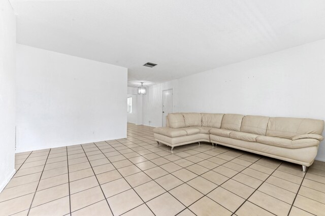 7000 NW 95th Ter, Tamarac, FL 33321 - unfurnished living room with visible vents and light tile patterned floors