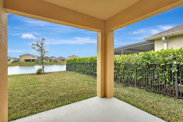 10771 SW Cremona Way, Port Saint Lucie, FL 34987 - view of yard with a water view, a patio area, and a residential view
