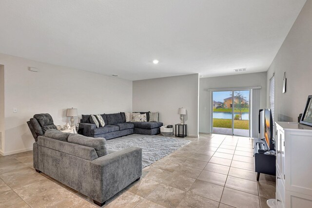 10771 SW Cremona Way, Port Saint Lucie, FL 34987 - living room featuring baseboards