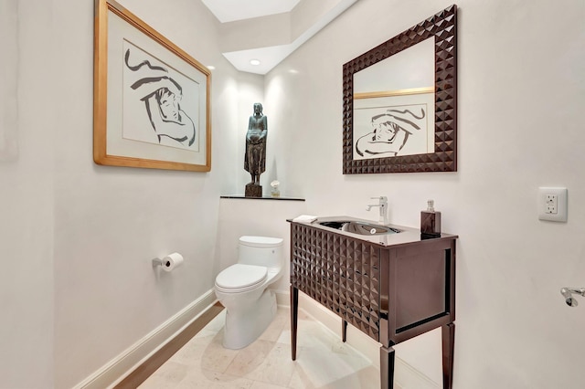 17652 Lake Estates Dr, Boca Raton, FL 33496 - bathroom featuring toilet, vanity, and baseboards