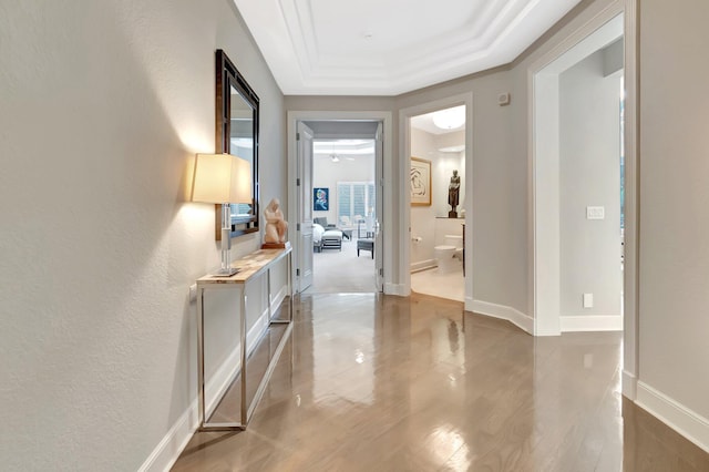 17652 Lake Estates Dr, Boca Raton, FL 33496 - corridor with a raised ceiling, baseboards, crown molding, and light wood-style flooring