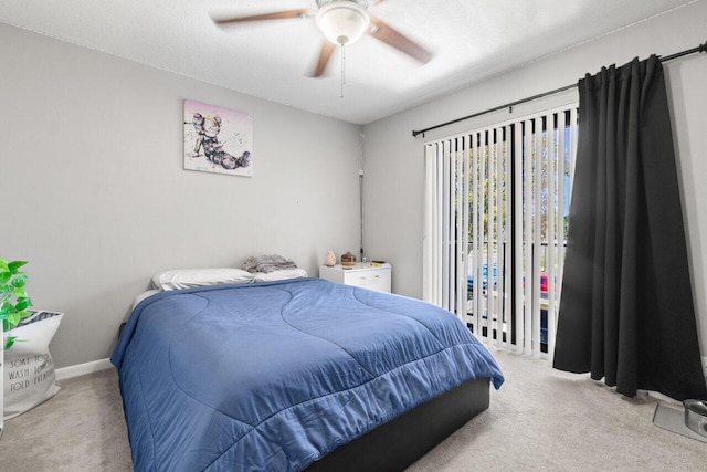 bedroom featuring ceiling fan, carpet, and baseboards
