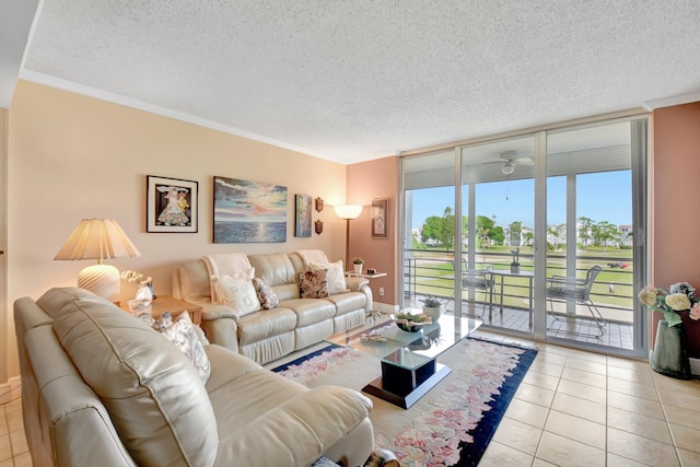 living area featuring a textured ceiling, tile patterned flooring, and ornamental molding