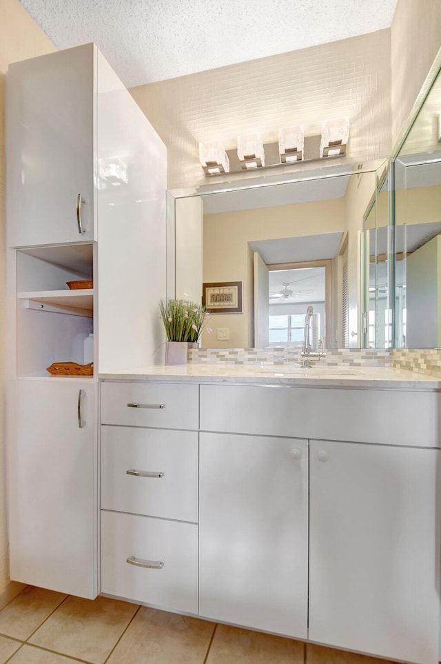 bathroom featuring tile patterned flooring and vanity