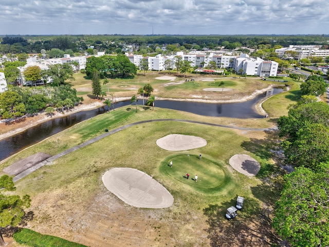 bird's eye view featuring view of golf course and a water view