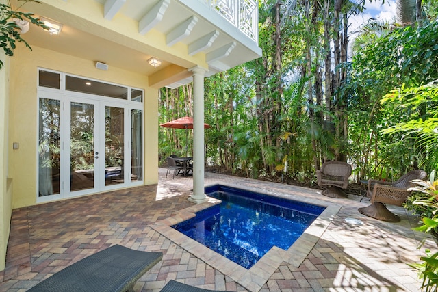 pool featuring french doors and a patio