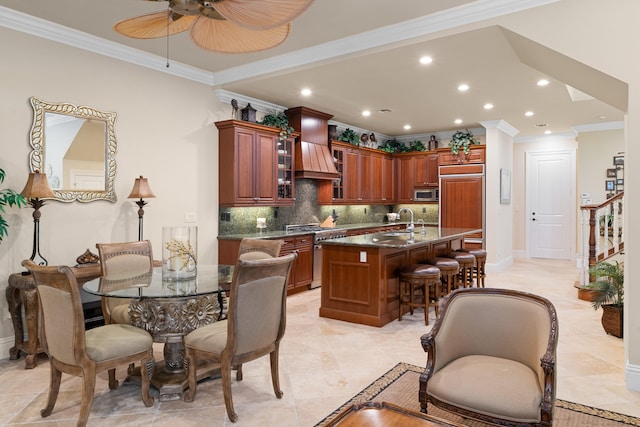 kitchen with custom range hood, premium appliances, backsplash, and ornamental molding