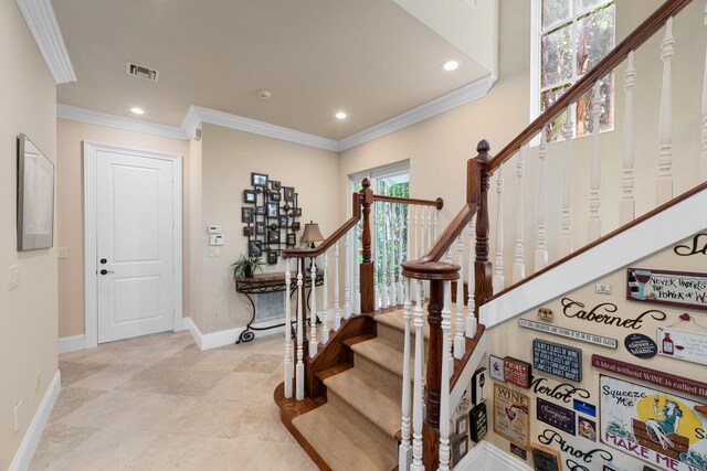 stairs with recessed lighting, visible vents, baseboards, and ornamental molding