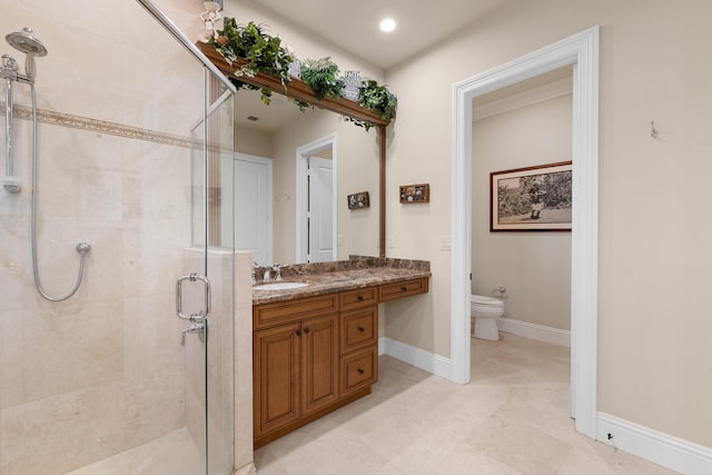 bathroom featuring baseboards, a shower stall, toilet, and vanity