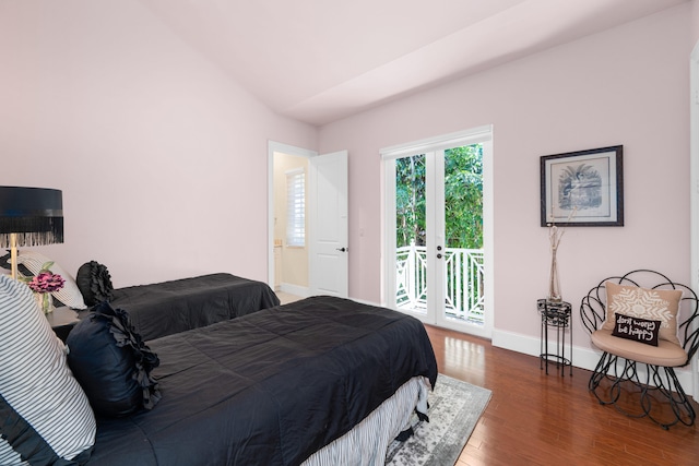 bedroom with baseboards, access to outside, and wood finished floors