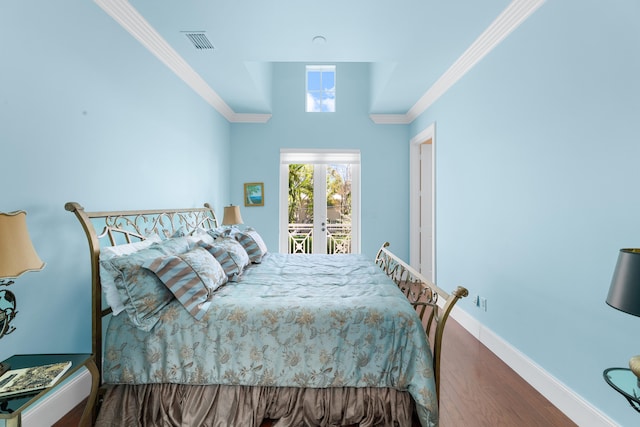 bedroom with visible vents, dark wood-type flooring, crown molding, baseboards, and access to outside
