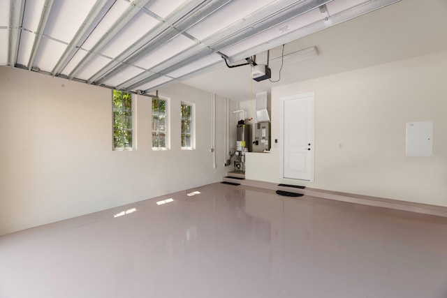 garage with a garage door opener and gas water heater