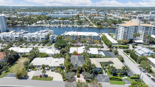 drone / aerial view with a residential view and a water view