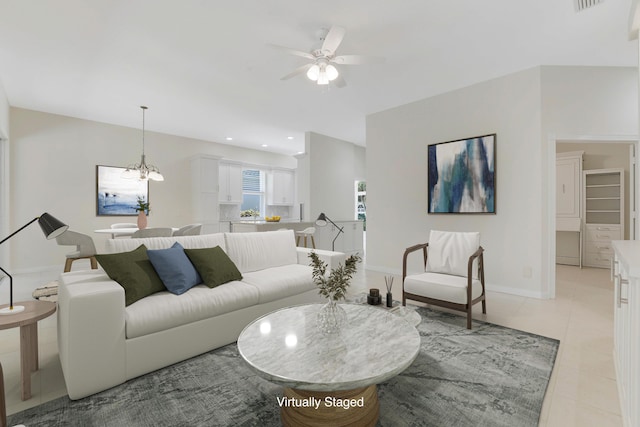106 Winter Club Ct, Palm Beach Gardens, FL 33410 - living area with ceiling fan with notable chandelier, baseboards, light tile patterned floors, and recessed lighting