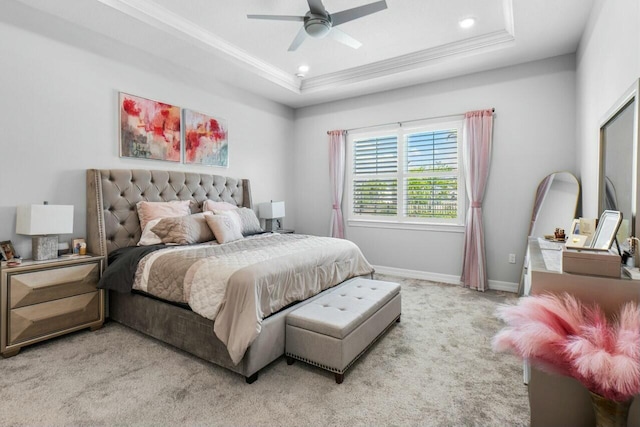 bedroom featuring a tray ceiling, ornamental molding, light carpet, and recessed lighting
