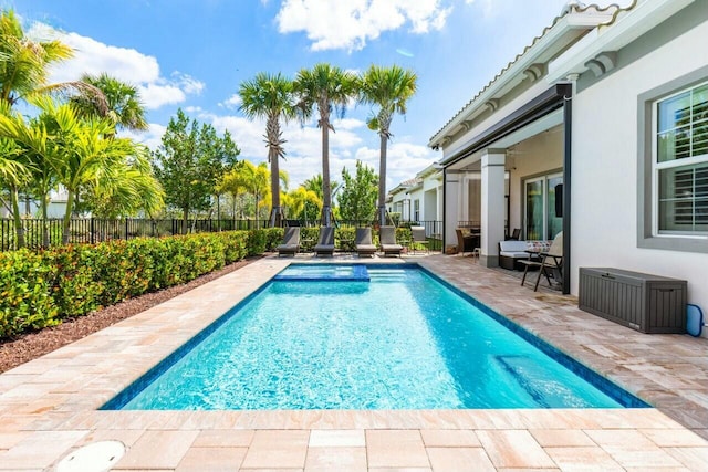 view of swimming pool featuring a fenced backyard, a patio area, and a fenced in pool