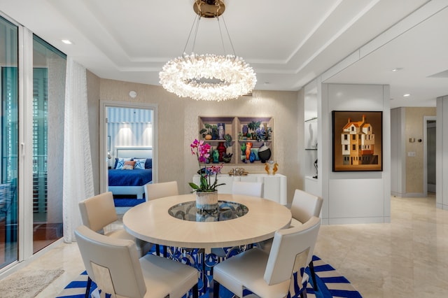 3740 S Ocean Blvd Unit 1205, Highland Beach, FL 33487 - dining room with elevator, a notable chandelier, and a tray ceiling