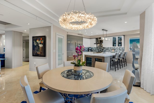 3740 S Ocean Blvd Unit 1205, Highland Beach, FL 33487 - dining room with a notable chandelier, a tray ceiling, wine cooler, and recessed lighting