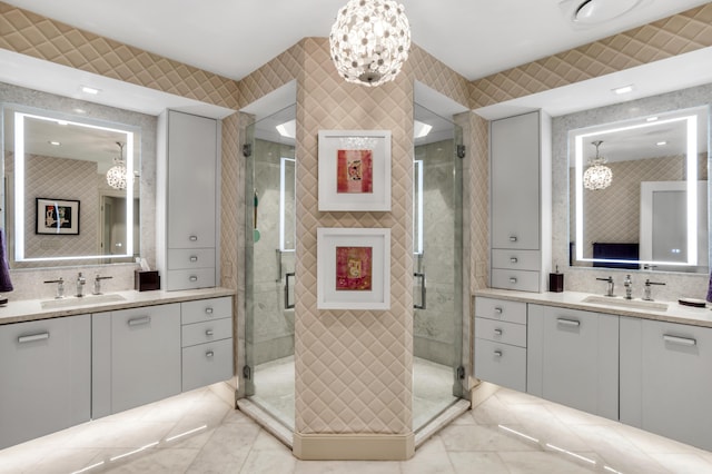 3740 S Ocean Blvd Unit 1205, Highland Beach, FL 33487 - full bathroom with a chandelier, two vanities, and a sink