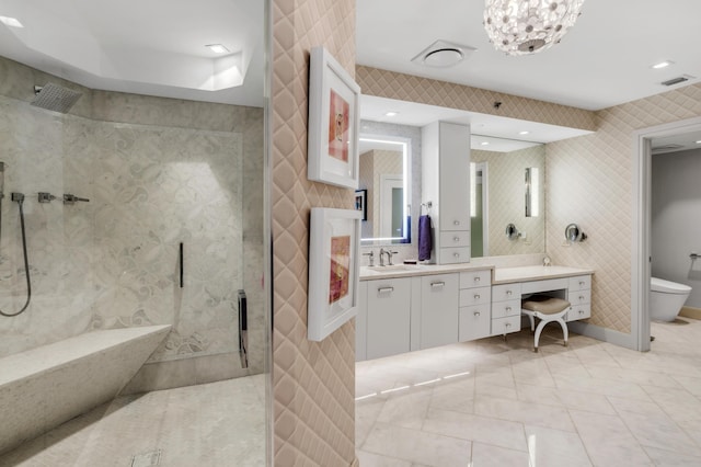 3740 S Ocean Blvd Unit 1205, Highland Beach, FL 33487 - bathroom with visible vents, toilet, vanity, tile walls, and walk in shower