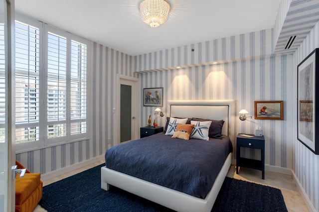 3740 S Ocean Blvd Unit 1205, Highland Beach, FL 33487 - bedroom featuring baseboards and wallpapered walls