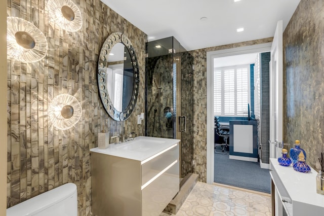 3740 S Ocean Blvd Unit 1205, Highland Beach, FL 33487 - bathroom with tile patterned flooring, toilet, vanity, and a stall shower