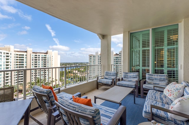 3740 S Ocean Blvd Unit 1205, Highland Beach, FL 33487 - balcony with outdoor lounge area and a water view