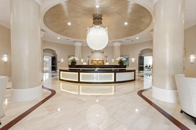 3740 S Ocean Blvd Unit 1205, Highland Beach, FL 33487 - welcome area featuring an inviting chandelier, decorative columns, and arched walkways
