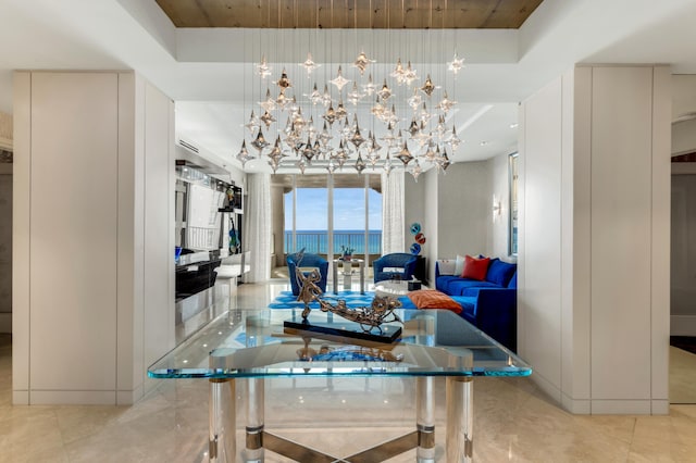 3740 S Ocean Blvd Unit 1205, Highland Beach, FL 33487 - dining space with a tray ceiling, wooden ceiling, and an inviting chandelier