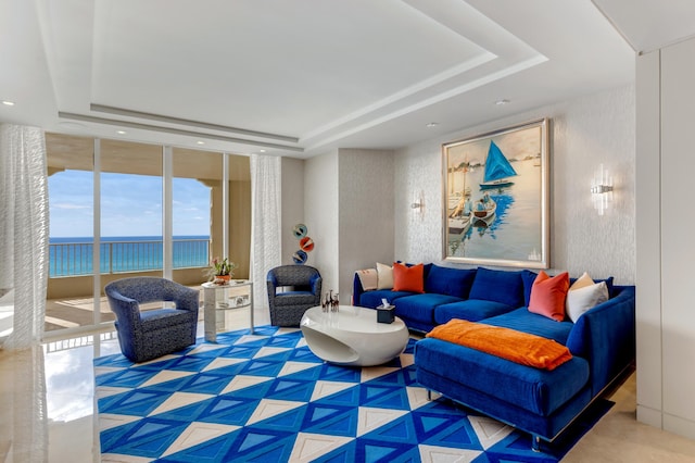 3740 S Ocean Blvd Unit 1205, Highland Beach, FL 33487 - living area with a wall of windows, a tray ceiling, and a water view