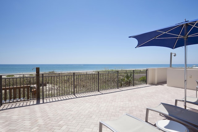 view of patio / terrace with a water view