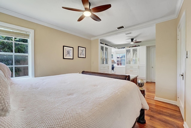 946 Paseo Morella, West Palm Beach, FL 33405 - bedroom featuring wood finished floors, multiple windows, ornamental molding, baseboards, and a ceiling fan