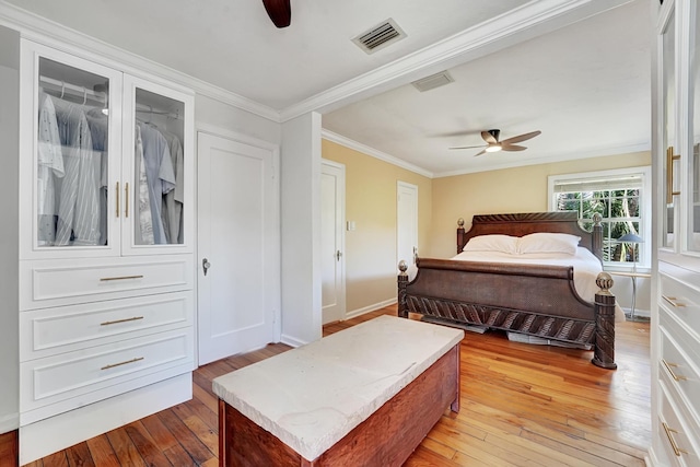 946 Paseo Morella, West Palm Beach, FL 33405 - bedroom with light wood finished floors, ornamental molding, baseboards, and a ceiling fan